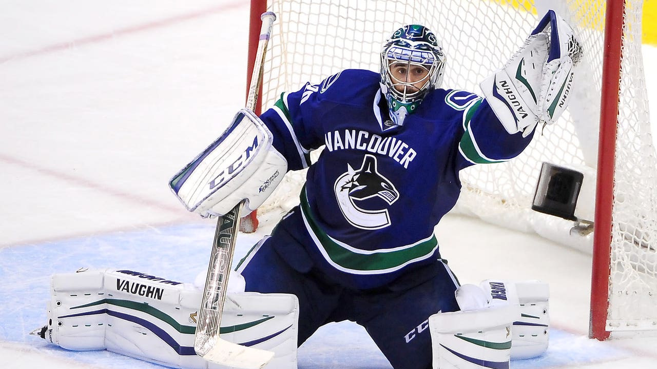 Canucks' Ryan Miller posts 300th career win, keeps Hurricanes winless